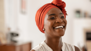 woman smiling with invisalign aligners in