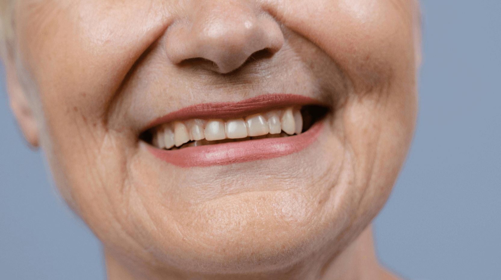 woman with dental implants smiling at High St Dental Care