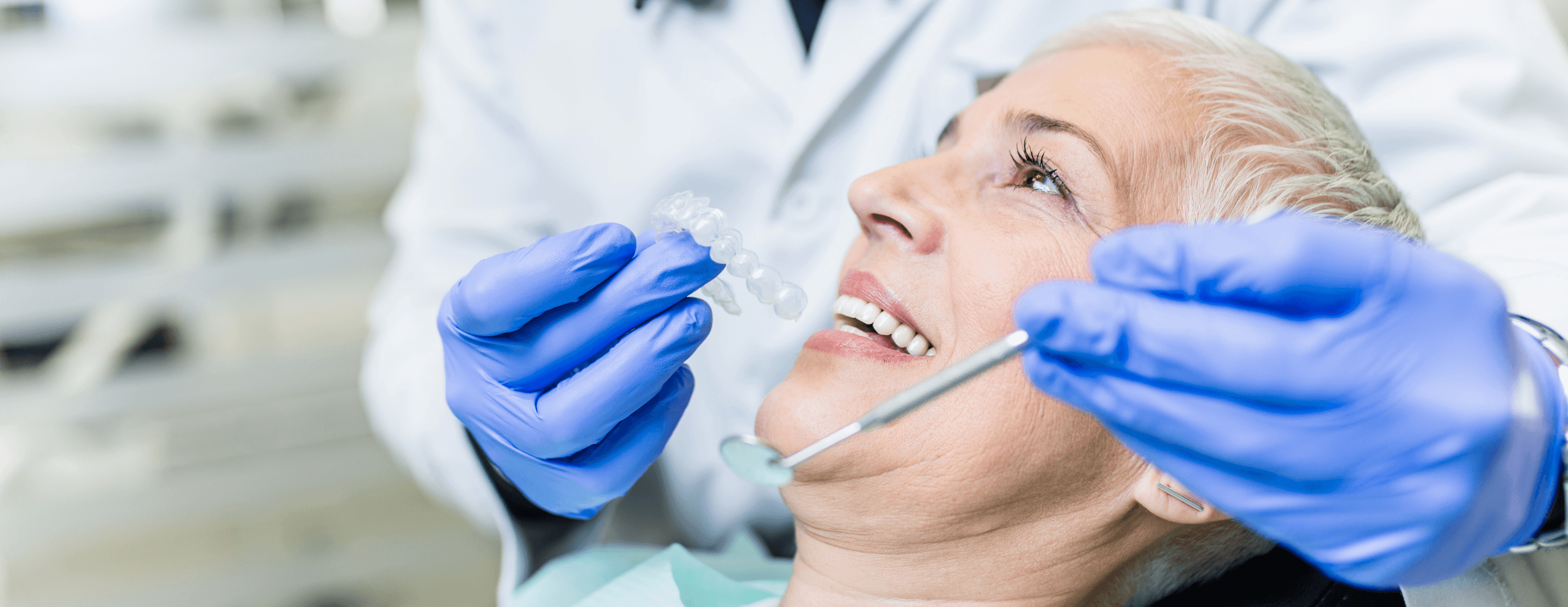 Woman getting a check up by a dentist at High Street Dental