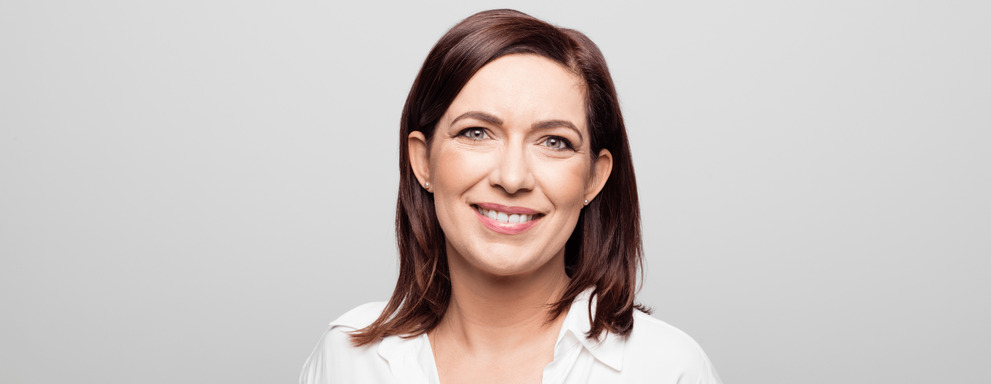 Woman smiling after gum disease treatment