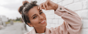 Woman smiling whilst wearing Invisalign