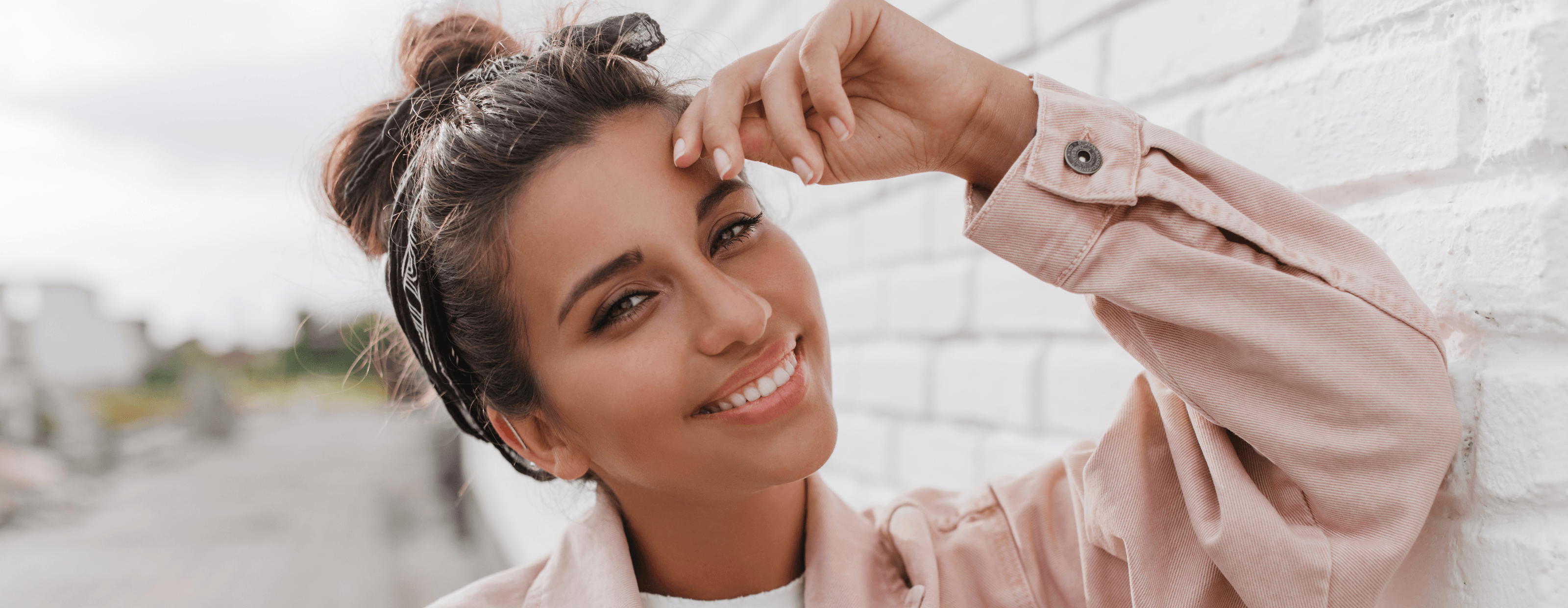 Woman smiling whilst wearing Invisalign